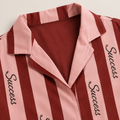 Maroon inner facing inside the striped pajama shirt collar